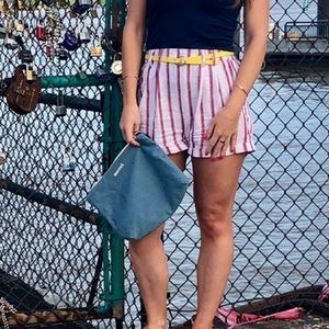 White and red striped shorts with yellow belt